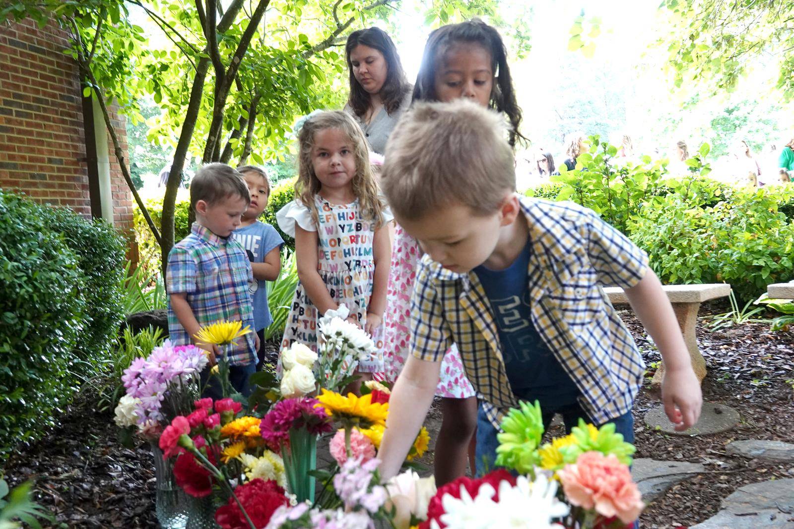 Father John Putnam lead all of the children and parents in prayer. 