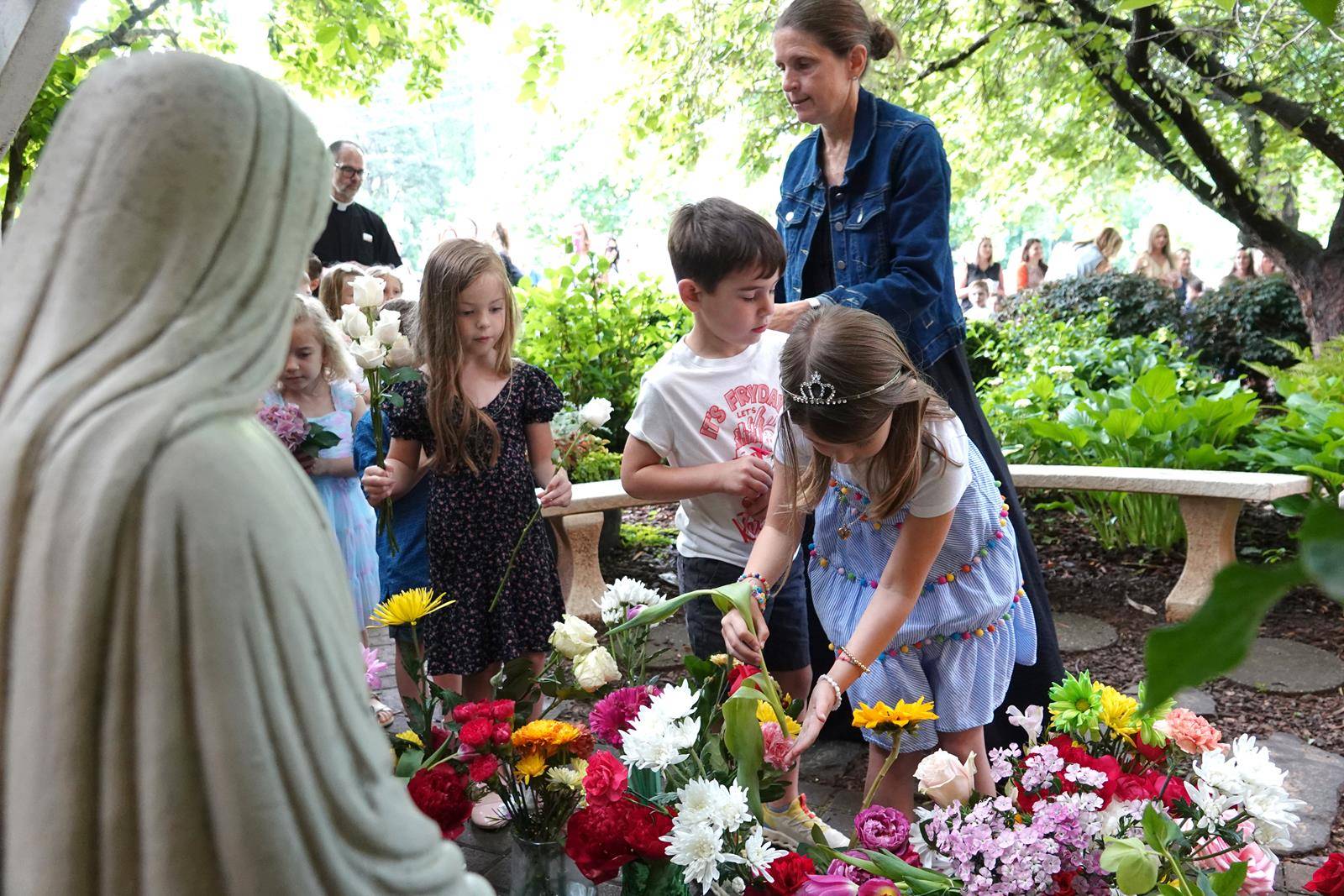 Father John Putnam lead all of the children and parents in prayer. 