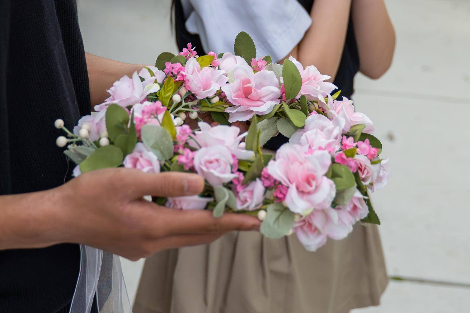 Students gathered outside Our Lady of the Assumption Church in Charlotte May 1 to crown a statue of the Blessed Virgin Mary. 