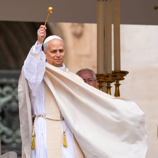 Pope Leo XIV blesses the faithful in St. Peter's Square with holy water at the beginning of his installation Mass at the Vatican May 18. (CNS/Lola Gomez)