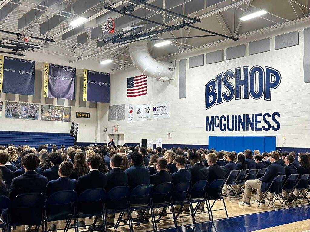 Students at Bishop McGuinness High School celebrate the first school Mass. 
