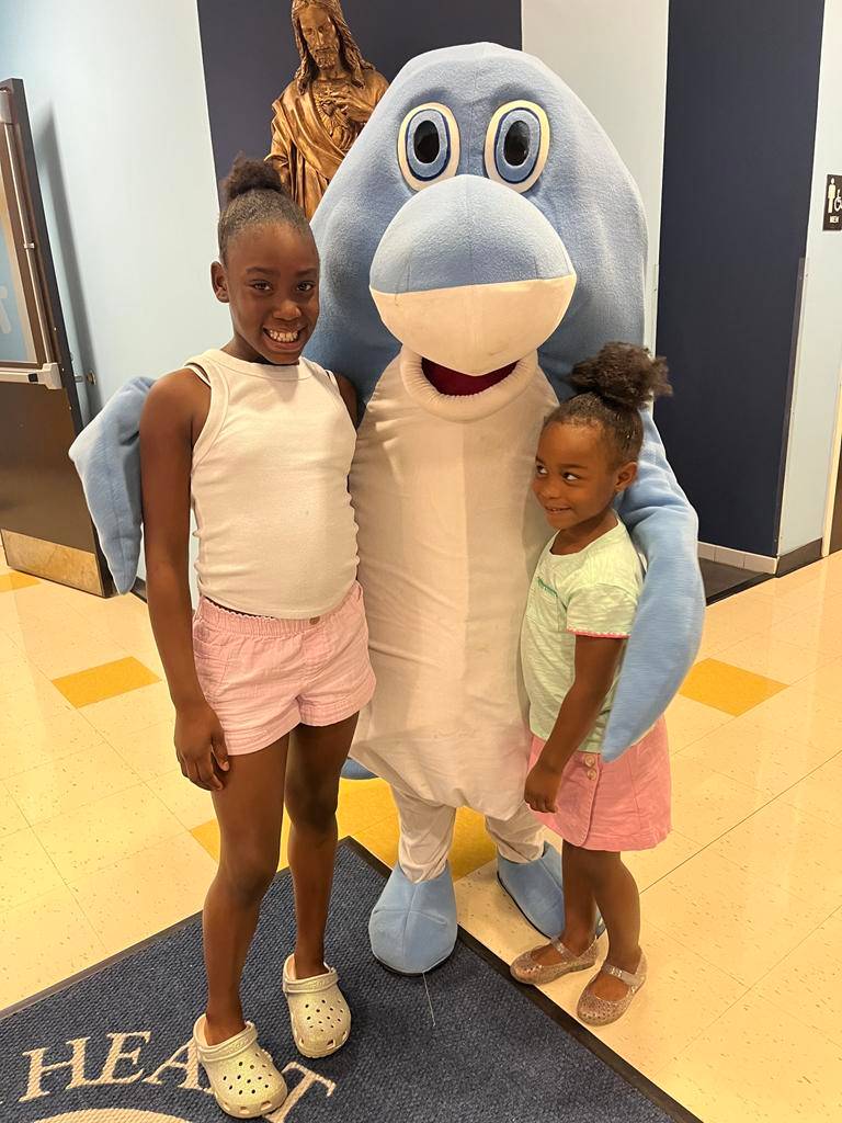 Sacred Heart students see their classrooms and work on their school spirit at the school’s open house. 