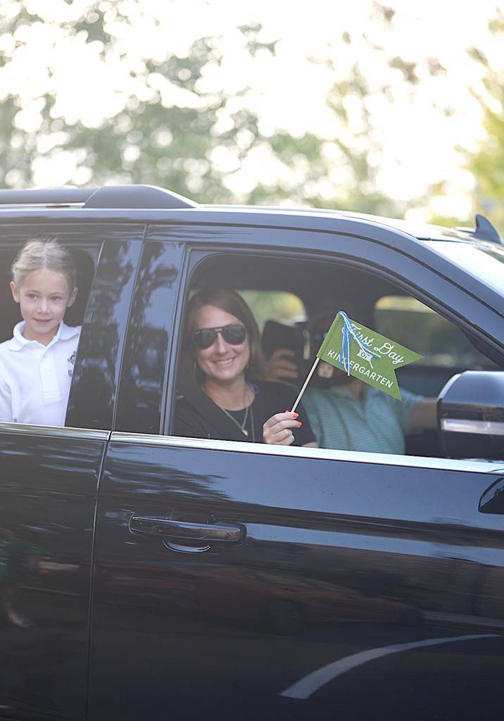 Smiles and waves from St. Patrick School in Charlotte students excited for the school year to start.