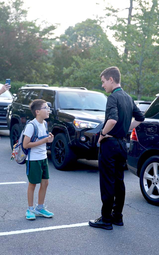 Smiles and waves from St. Patrick School in Charlotte students excited for the school year to start. 