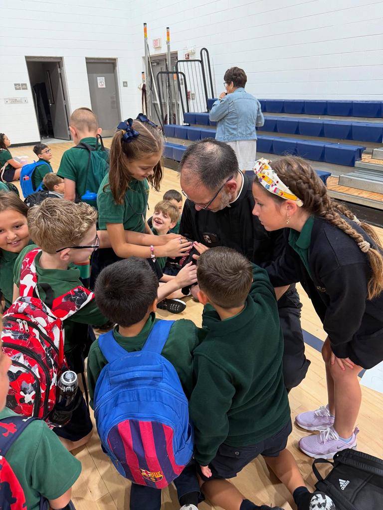 Students smile on the first day of school at St. Mark School in Huntersville. 