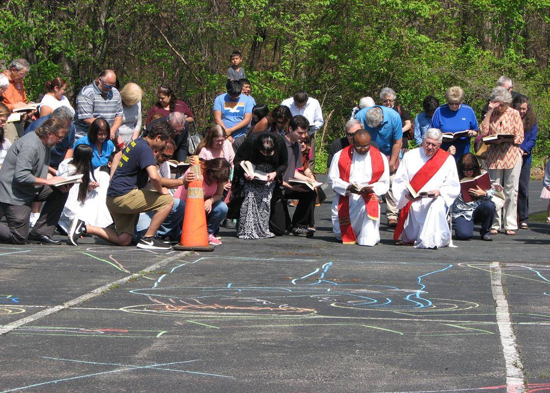 KING —. Several middle and high school artists from the Good Shepherd drew each of the stations in the parking lot behind the church.  Father Basil Sede and Deacon Davis Boisey led the congregants through the stations. (By Annette Tenny)