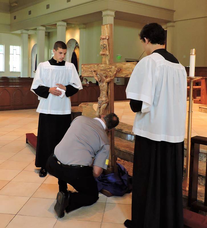 HUNTERSVILLE — Parishioners prayed the Stations of the Cross, then the Passion and then the Divine Mercy and Veneration of the Cross. (By Amy Burger) 