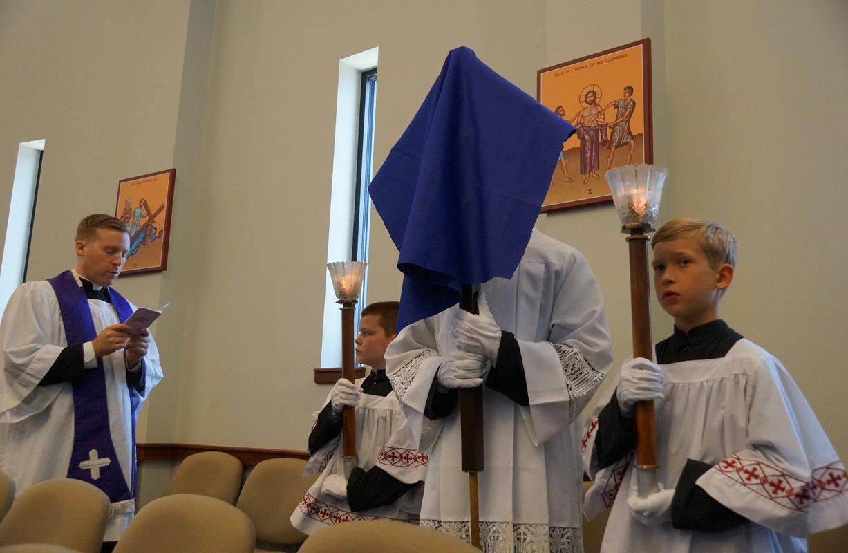 Afterwards the faithful venerated the Cross while the St. Ann’s schola and choir chanted the Improperia (Good Friday Reproaches), followed by reception of Holy Communion. (By John Cosmas) 