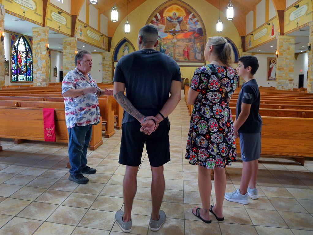 Knight of Columbus Jim Brooks offers a church tour to visitors. (Copy)