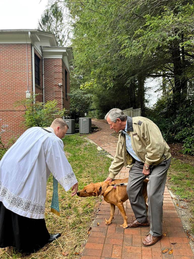 Father Jason Barone blesses pets at Our Lady of the Mountains parish in Highlands for the Feast of St. Francis of Assisi. 