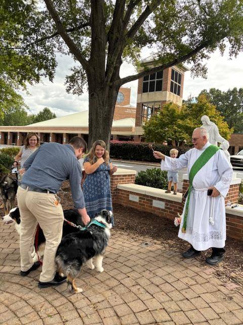 Deacon John blesses animals at Holy Family Church in Clemmons.