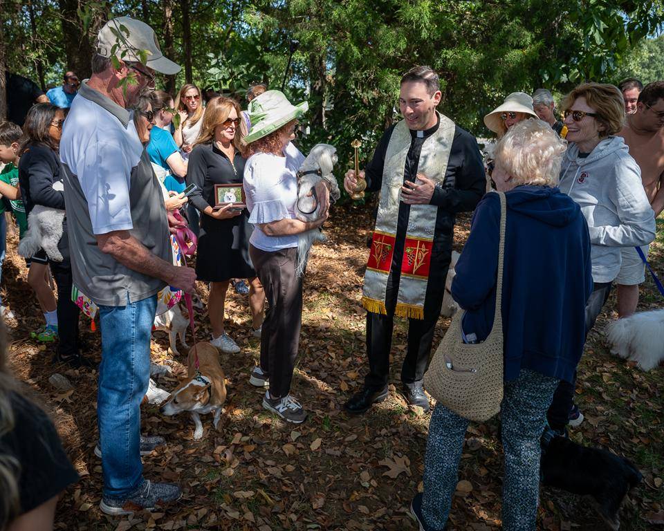 Father Patrick Cahill and Father Binoy Davis blessed cats, dogs, birds and even some reptile friends for the Feast of St. Francis of Assisi at St. Matthew Church in Charlotte. 