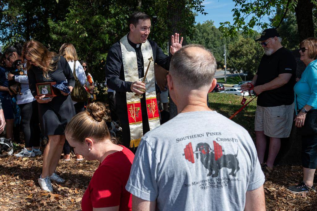 Father Patrick Cahill and Father Binoy Davis blessed cats, dogs, birds and even some reptile friends for the Feast of St. Francis of Assisi at St. Matthew Church in Charlotte.