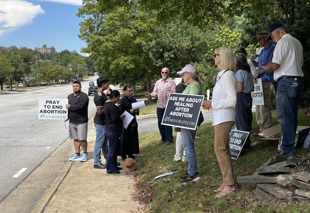 Parishioners at Immaculate Conception Church in Hendersonville gathered Sept. 20 outside the Asheville abortion facility to offer community outreach.
