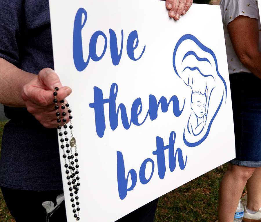 Faithful show support for life during a Life Chain outside St. Mark Church in Huntersville. 