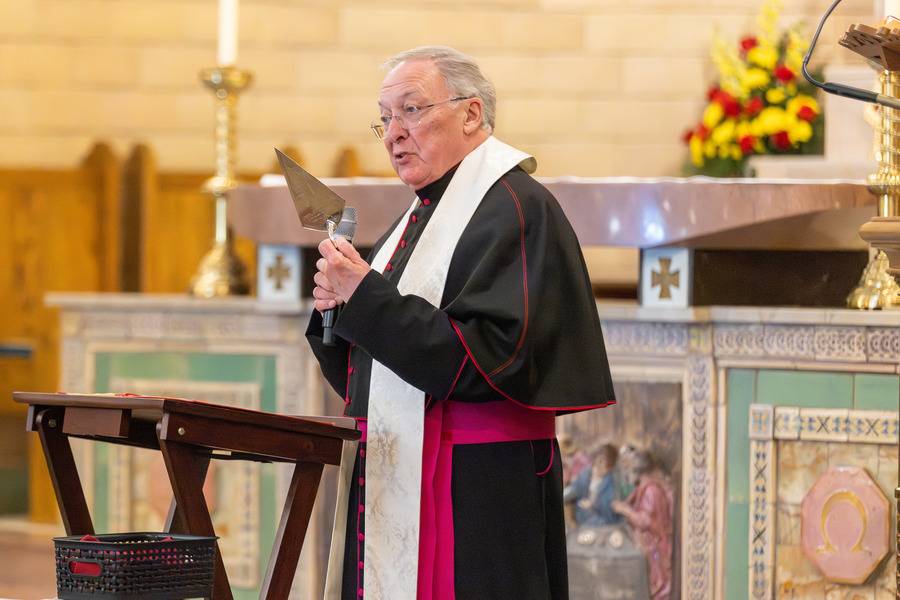 Monsignor Roger Arnsparger with a 119-year-old silver trowel presented by Guastavino to the basilica’s first rector.  