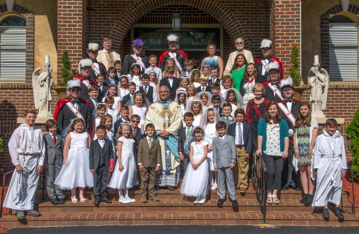 DENVER — Youth at Holy Spirit Church recently received the sacrament of first Holy Communion during Masses offered May 6 by Father Carmen Malacari, pastor, and May 11 by Bishop Peter Jugis. (Photos by Doreen Sugierski | Catholic News Herald)
