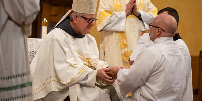 14 men instituted as acolytes; deacons reaffirm promises