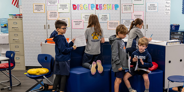 Students enjoy classroom furniture made for kids’ needs
